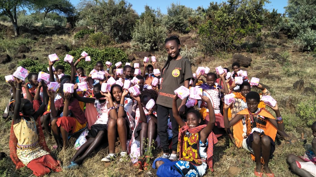 Girls holding sanitary pads