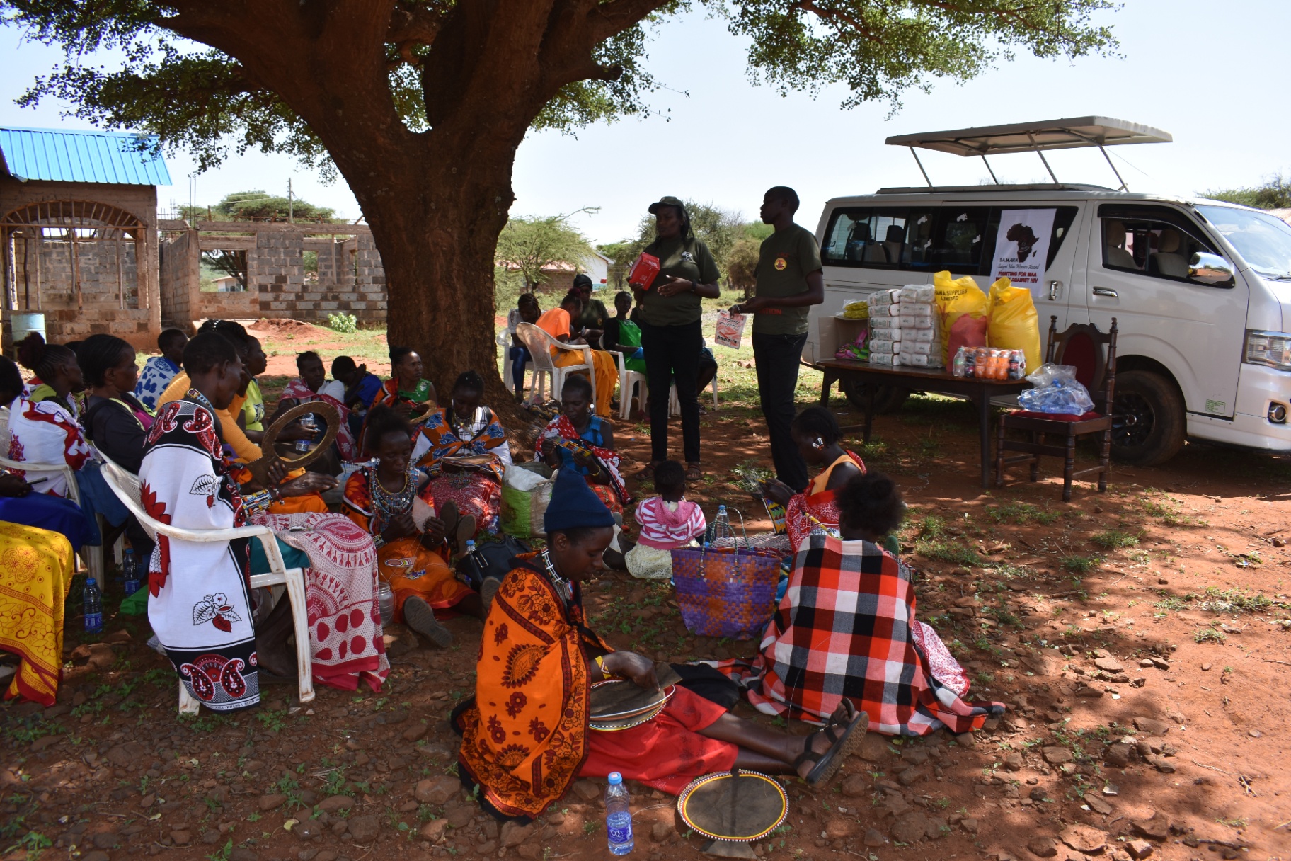 Community gathering under tree